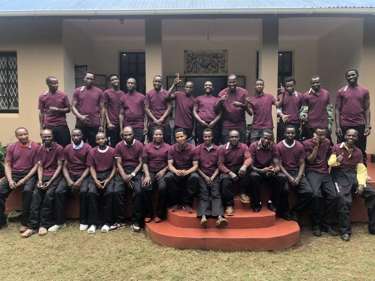 The Nyange team together outside their base