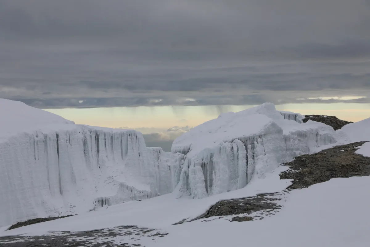 Glaciers beneath a cloudy mountain sky